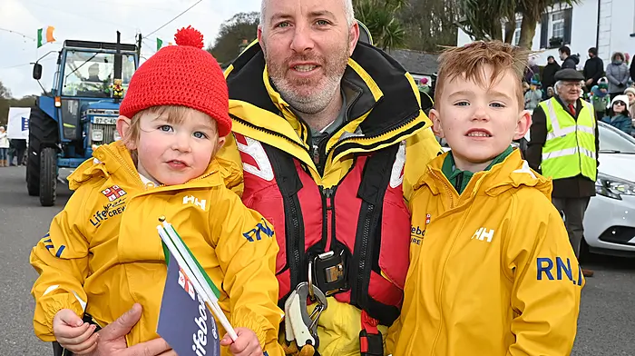 Above: Courtmacsherry's Kevin Young with his children Joe and Sean at the local St. Patrick's Day Parrade. Meanwhile, in Clonakilty Mira Morenko was celebrating the day in Clonakilty. (Photos: Martin Walsh & Denis Boyle)