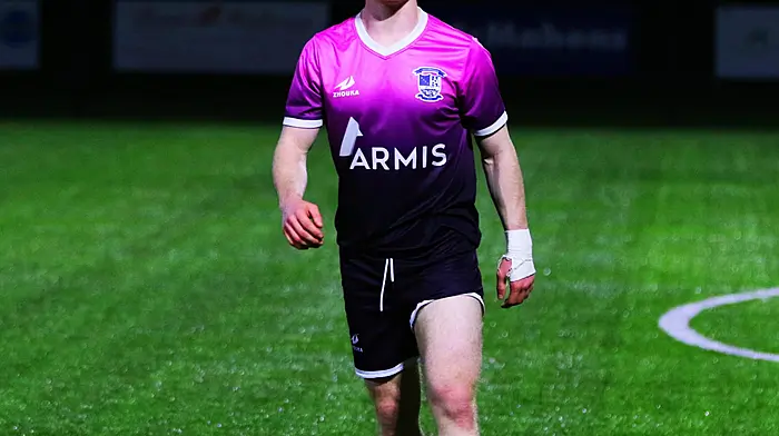 Ballinhassig AFC’s midfielder Finn O'Brien at a recent league fixture, sporting the club’s away strip of pink and black.
