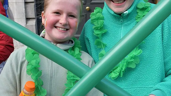 Elsie White and Phoebe Stanness enjoying  the St Patrick's Day parade in Skibbereen. (Photo: Anne Minihane)