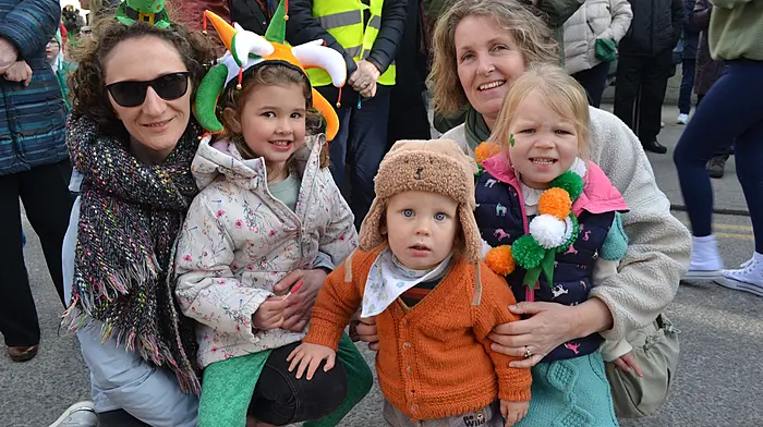 Meadnh O'Leary and Anna Jagielska with Sorcha, Iarlaith and Eadaoin O'Connell at the Skibbereen St. Patricks Day Parade, where (right) Skibb local and World Kickboxing Champion Evan Collins was Grand Marshall, here alongside St Patrick and kickboxing coach Ian Kingston. (Photos: Anne Minihane)