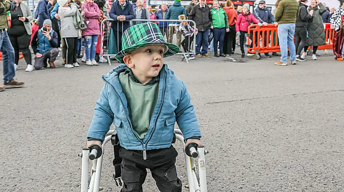 Tom Óg Dickinson enjoy the music at the Castletownbere St. Patrick's Day Parade. (Photo: Anne Marie Cronin)