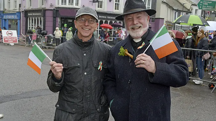 (Left) Refusing to let the weather get them down in Bandon were Kenneth Beamish and Andrew Coleman. Meanwhile, enjoying Lá Fhéile Pádraig in Clonakilty were Maeve and Ella O'Sullivan with Anna and Ellen Meade. (Photos:  Denis Boyle and Martin Walsh)