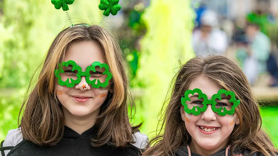 Abigail and Megan Cooper from Bantry, two among the thousands of people who attended the town's St. Patrick's Day parade. (Photo: Andy Gibson)