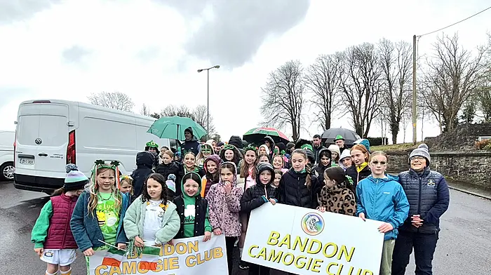 Members of the Bandon camogie club’s successful minor team, along with their coaches, showing off their silverware at the St Patrick’s Day parade last Monday.