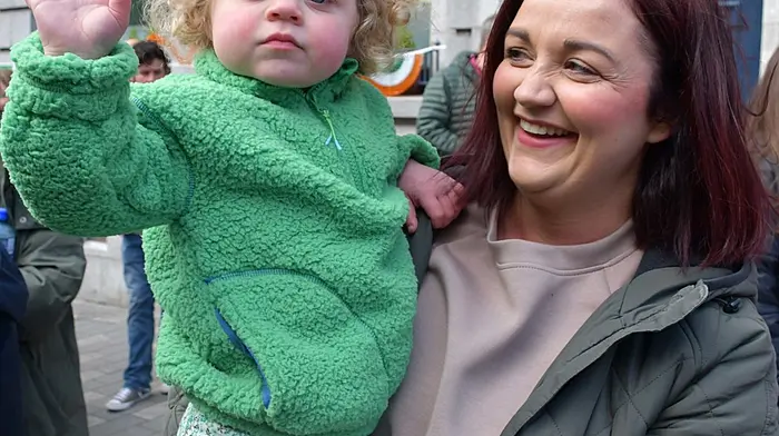 Leah and Emma O'Driscoll enjoying the parade in Skibbereen on Monday. (Photo: Anne Minhane)