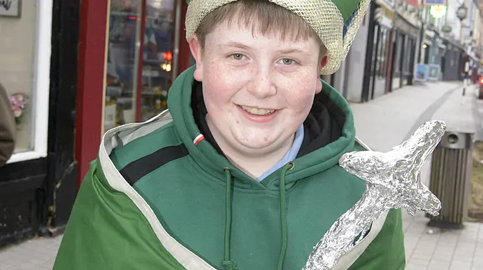 Keenan Crean, a student at Crossmahon National School, who only this week celebrated his Confirmation, getting ready for the St Patrick’s Day parade. (Photo: Denis Boyle)