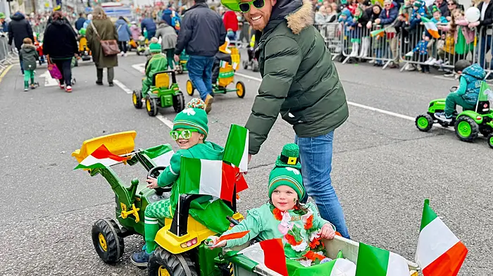 Colm and Ríonach O'Brien with dad Peter walking with the Carrigaline IFA and enjoying the St Patrick's Day parade in Carrigaline.