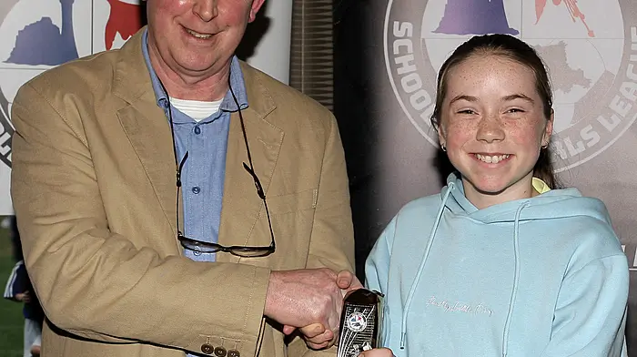 WCSSL Chairman Declan Deasy presents the U12 Girls Premier League Player of the Year to Eirinn Coppinger (Clonakilty).