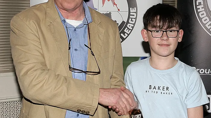 Donagh Griffin (Bunratty United AFC) receives the U12 Boys League One Player of the Year award from WCSSL Chairman Declan Deasy.
