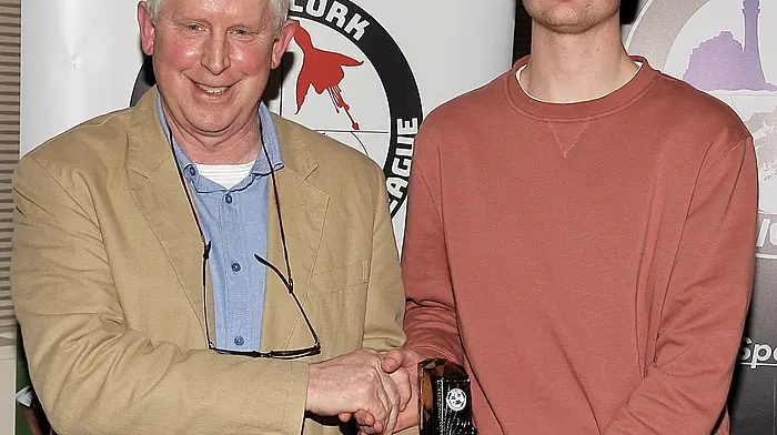 U16 Boys Player of the Year Reuben McAtasney (Beara United) receives his award from WCSSL Chairman Declan Deasy.