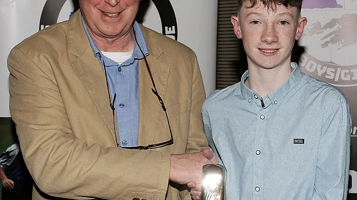 Donnacha Collins (Drinagh Rangers) receives the U13 Boys Championship Player of the Year award from WCSSL Chairman Declan Deasy.