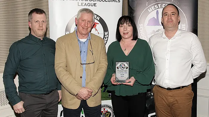 WCSSL Chairman Declan Deasy presents the Club of the Year to Clonakilty AFC. Accepting the award were Mark Harrington, Sam Doharty and Craig Scot.