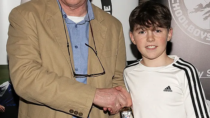 West Cork Academy U12 Player of the Year 2023-24 Aodhan O'Mahony (Ardfield FC) with WCSSL Chairman Declan Deasy.