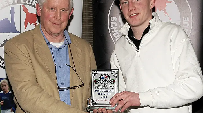 WCSSL Chairman Declan Deasy presents the Boys' Team of the Year to Kilmichael Rovers FC. Accepting the award was Tim Sweeney.
