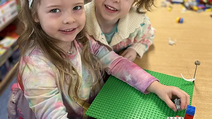 Dromore National School’s junior infants Hannah Daly and Aeilín O'Shaughnessy wearing bright colours for Rainbow Day.