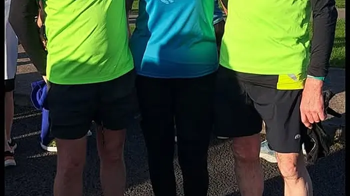 Philip O’Donoghue, Tracton AC, who recently hit a major milestone completing his 100th parkrun in Tramore Valley Park, celebrating with Donncha and Mags Moynihan.