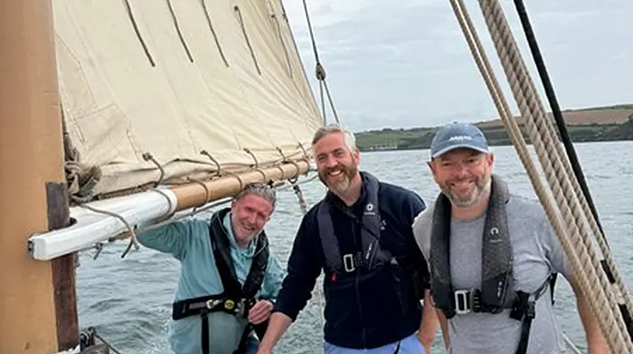 Minister O’Sullivan along with crew members of Sailing Into Wellness in Kinsale Harbour.