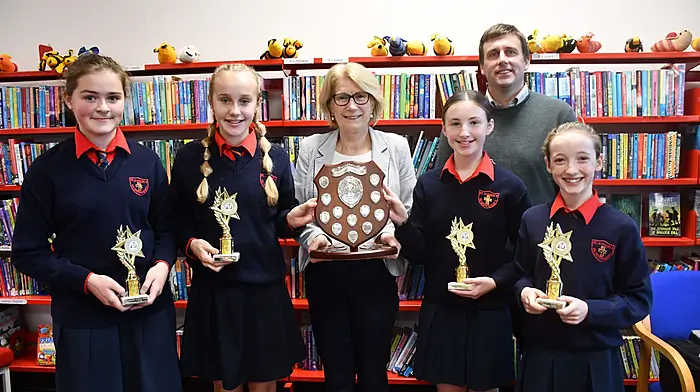 St Joseph's Girls National School’s quiz team of Zara Mjullins, Sophie Dineen, Ciara Crowley and Saidbh O'Driscoll were the winners of the annual Skibbereen Library Quiz.  Quizmaster Veronica Whooley presented the trophy to the team and teacher Paddy Hickey is also included in the photo. (Photo: Anne Minihane)