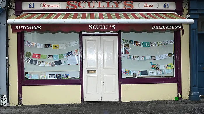 Cards and best wishes adorn the windows of the recently closed Scully's Butchers and Deli along Pearse Street, Clonakilty.   (Photo: Martin Walsh)