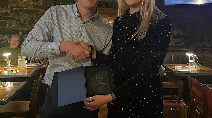 Caption Maeve Pigott with Tracton AC chairman Connor O'Mahony. Maeve was presented with the Standout Achievement Award in recognition of her inspiring journey towards Ironman status in 2025. She's also outstanding PRO for the club.