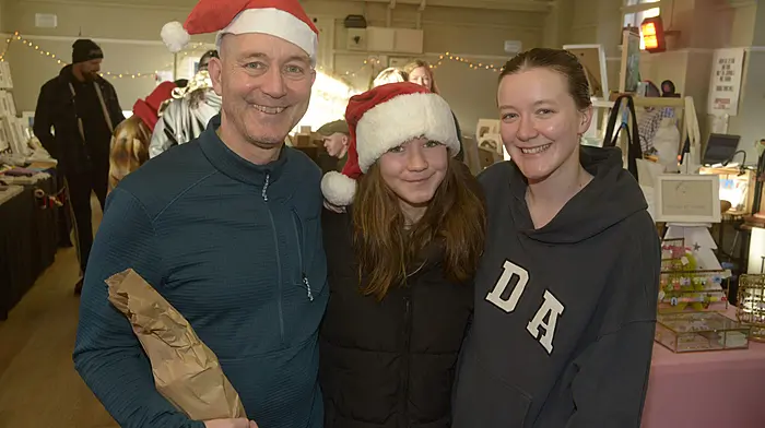 NEWS 7/12/2025 Pictured at the Kinsale Christmas market at the Temperance hall was Maisie, Richie and Lottie Hughes from Kinsale. Picture Denis Boyle