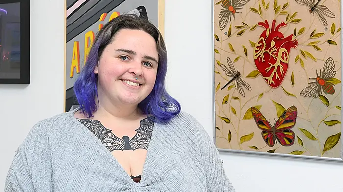 Sarah Magnier-Whooley beside her glass painting titled 'The Heart of it All' that is on display at the Clonakilty Community Arts Cente on Ashe Street, Clonakilty.  (Photo: Martin Walsh)
