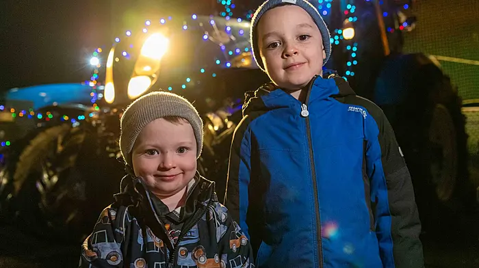 Sennan and Donnacha Dullea from Dunmanway enjoying the lit up tractors at the tractor run hosted by Kilmeen Macra last Sunday. Proceeds of the run were in aid of Reenascreena National School and Progressive Supranuclear Palsy.  (Photo: Andy Gibson)