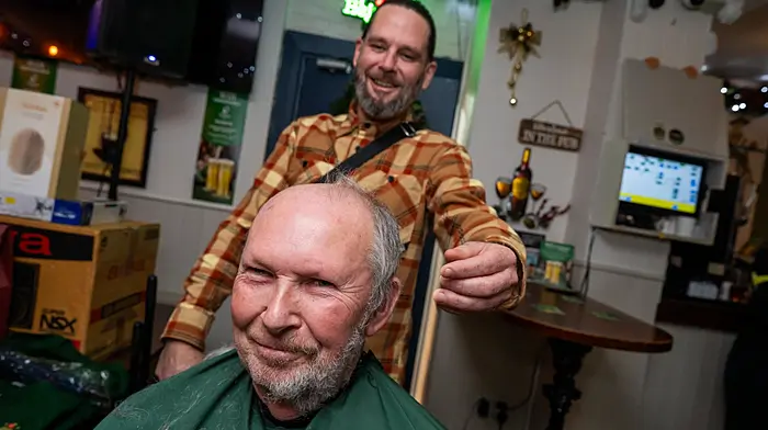 Mick Scanlon goes under the razor of Kinsale’s Paul the Barber at the annual Kitty O’Sé’s Headshave in Kinsale which was held in aid of Kinsale Hospital and Daycare. (Photo: John Allen)