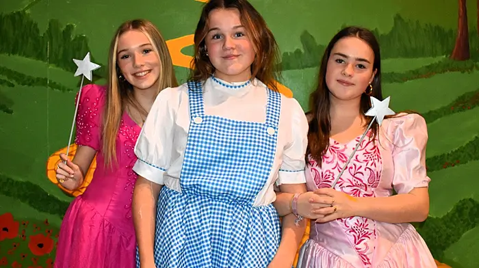 Schull Community College students Annalee Barry, Rosa Barrett and Heidi Hogan as Dorothy and the good witches, rehearsing for the upcoming Wizard of Oz panto.