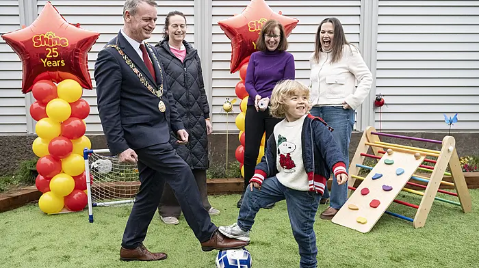 Lord Mayor of Cork, Fergal Dennehy, gets in some ball practice with Oscar Knight from Carrigaline as Caroline Giltinan (plant director, PepsiCo), Grace O'Callaghan (manager, Early Intervention Classes Shine) and Olivia O'Neill watch on during the opening of the fun garden at the Shine Centre in Carrigaline.   (Photo: Gerard McCarthy)