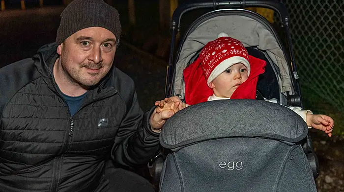 Daniel and Dylan Lucey from Enniskeane enjoying looking at the lit up  tractors at that Kilmeen Macra Christmas tractor run.  (Photo: Andy Gibson)