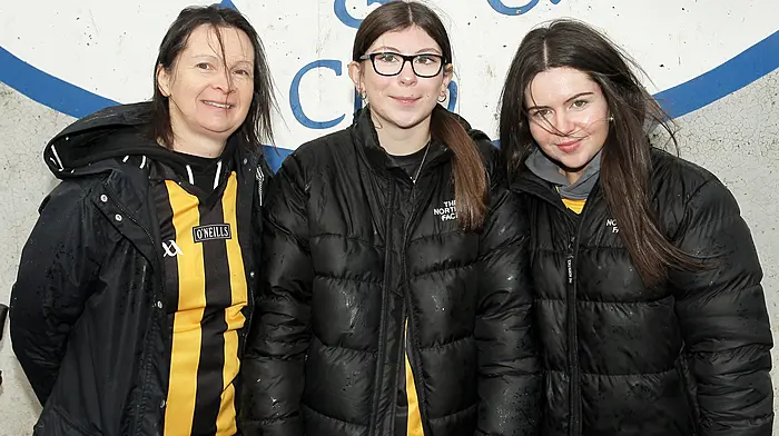 Eilish, Saoirse and Jennifer O'Donovan in Clonmel cheering on Kilbrittain. (Photo: Paddy Feen)