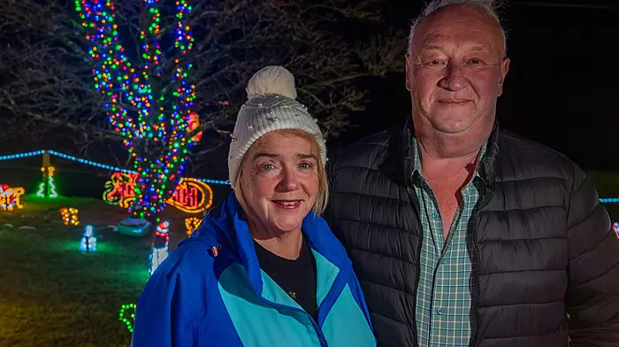 Dunmanway, West Cork, Ireland. 18th Dec, 2025. A huge Christmas Lights display is wowing the population of Dunmanway and its surrounds. The brainchild of Michael & Chrissy O'Mahony, the charity light display has even been viewed by a family from Co. Tipperary. The lights have been a tradition for 20 years and this year the proceeds are going to Breakthrough Cancer Research; West Cork Palliative Care and Co-Action Dunmanway. The display runs until 6th January. at P47 NN67. Pictured are Michael & Chrissy O'Mahony with their Tree of Remembrance in the background. Picture: Andy Gibson.