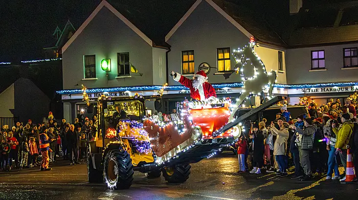 “Taking time for a quick visit,” Despite all his preparations for the big day, Santa Claus took time off to visit the village of Leap for their Leap Light Up Parade and meet the children of the parish. The funding raised from the event will benefit the primary schools of the parish.