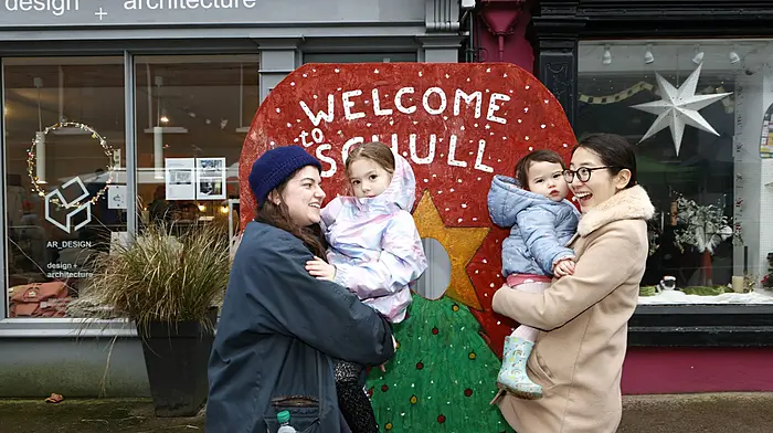 Maria O'Toole and her daughter Michaela (5), with Shoko Desmond and her daughter Emiko (2), as they explore the Winter Solstice Christmas Market in Schull. Photo by Carlos Benlayo