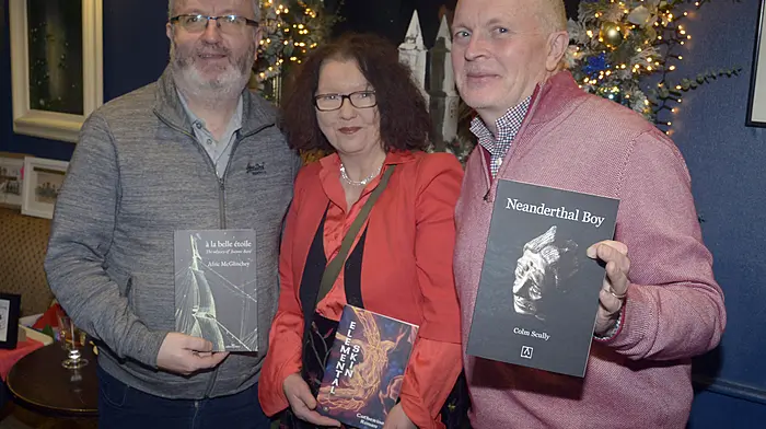 NEWS 14/12/2025 Pictured at the Christmass Market hosted by O'Donovans on the square, Bandon was Sean O'Donovan with Catherine Ronan and Colm Scally with their books of poetry. Picture Denis Boyle
