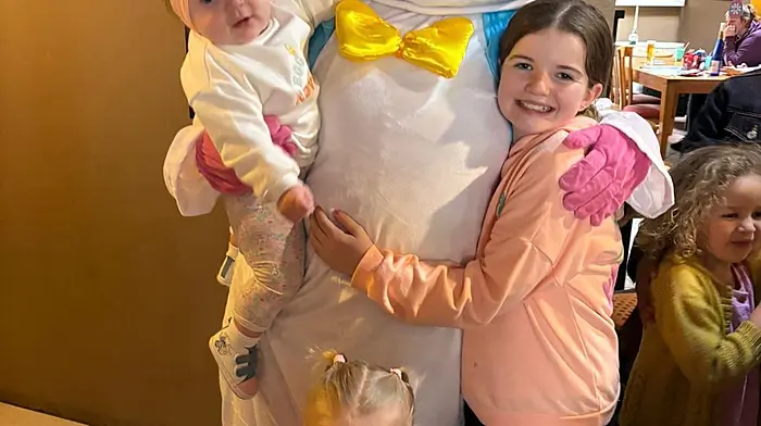 Caoimhe Murray, Leah Murray and Ayda O’Brien enjoying the Easter egg hunt in Dunmanway with the Easter Bunny.