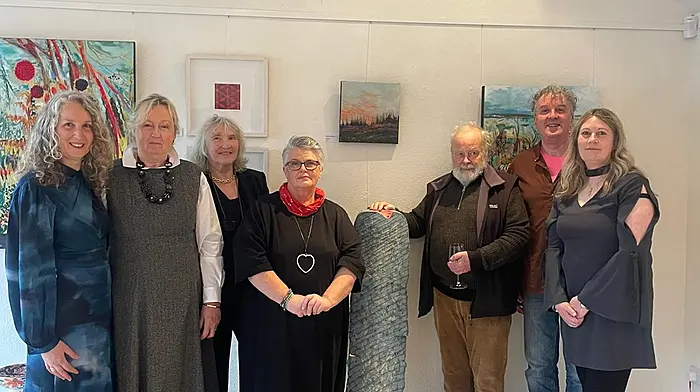 The Rossmore Artists Anne Harrington Rees, Eadaoin Harding Kemp, Etain Hickey, Lesley Cox, Jim Turner and Sara Hodson with Pol O’Colmain who officially opened the exhibition ‘Across the Fields’ at Cnoc Bui, Union Hall.