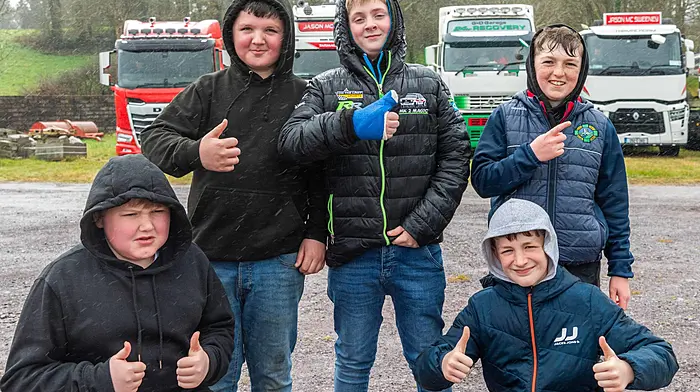 Jason Bennett from Rossmore (with the broken thumb) with Patrick Corcoran, William Shorten, Gearóid Daly and Cillian Hurley, all from Ballinacarriga, enjoying the Ballinacarriga charity tractor, car and truck run which took place to raise funds for Cancer Connect, Ballinacarriga National School and Randal Óg GAA club.   (Photo: Andy Gibson)