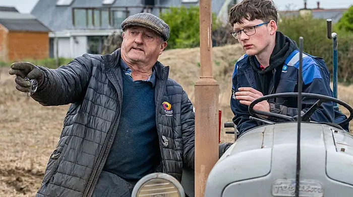 John O'Neill from Ballinadee discussing tactics with competitor Diarmuid Kearney from Kilmacsimon at Timoleague Ploughing Association’s annual ploughing match which was held on the lands of the Sexton family, Courtmacsherry.   (Photo: Andy Gibson)