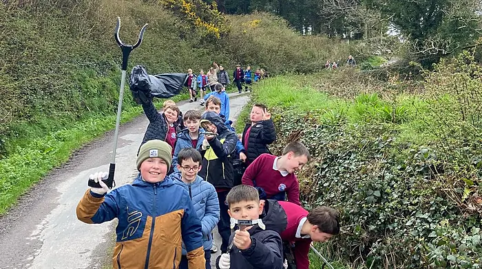 Third and fourth class pupils from Rath National School doing a litter pick on the roads adjacent to the school as part of Baltimore Tidy Towns community clean-up.