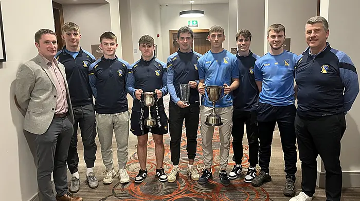 Mount Saint Michael senior footballers who are Munster champions and county champions receiving their Team of the Month award in Cork.  From left: Stephen Murray (principal), Padraig Tobin, Jerome McCarthy, Ben Sheehy  (captain, Munster Colleges team), Jerry McCarthy, Ronan Hayes (captain,  Cork Colleges team), Dylan Scannell, Mark McCarthy and Mike Keohane (trainer and coach).