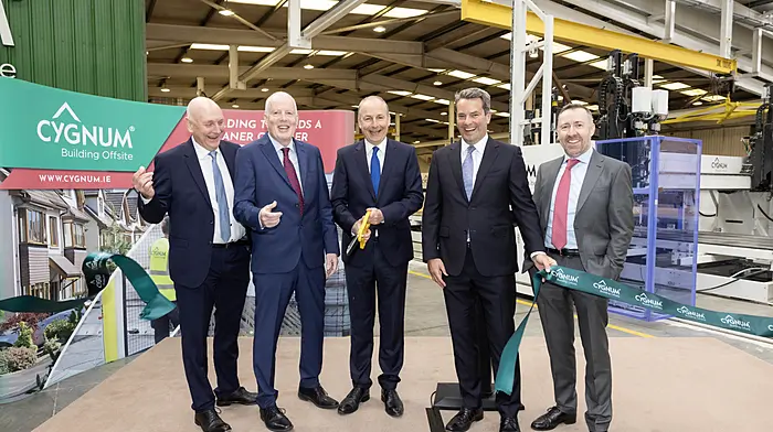 ***REPRO FREE***9th April 2026An Taoiseach Micheál Martin officially opens Cygnum’s €8m factory extension in Macroom, Co. Cork. The expansion will enable the offsite timber manufacturer, recently acquitted by the Chadwicks Group, to deliver up to 2,500 homes annually, and support the future hiring of 150 new employees.Pictured are (L-R) Patrick Atkinson, Chief Executive of Chadwicks Group, John Desmond, Managing Director of Cygnum, An Taoiseach Micheál Martin, John Paul O’Reilly, Managing Director, Specialist Products Division, Chadwicks Group, and John O’Callaghan, Finance Director, Cygnum.