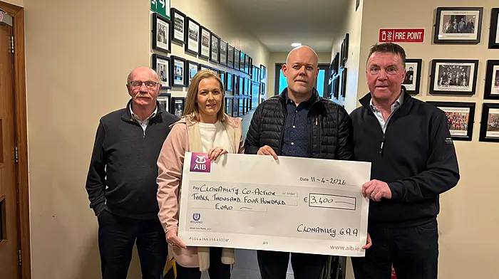 James O’Donovan (organiser of the fundraiser),  Brid Cahill O’Flynn, Diarmuid Cahill and Tom Mannix (club chairperson) at the presentation of funds from the St Stephen’s Day walk/run. CoAction was the chosen recipient of the proceeds raised.