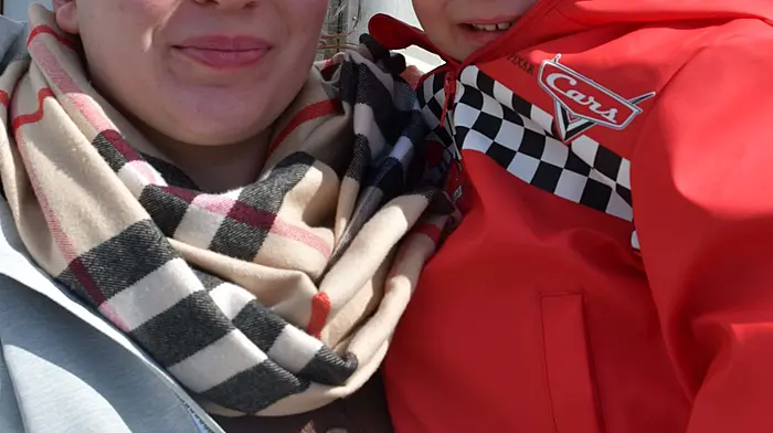 Kelli and Lochlainn O'Shea from Skibbereen watching all the activity at the start of the cheval ride last Sunday afternoon. (Photo: Anne Minihane)
