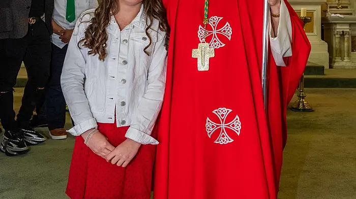 Victoria Smusz from St Mary's National School with Bishop Fintan Galvin after the confirmation ceremony which was held at St Patrick’s Catholic Church in Dunmanway on Wednesday.   (Photo: Andy Gibson)