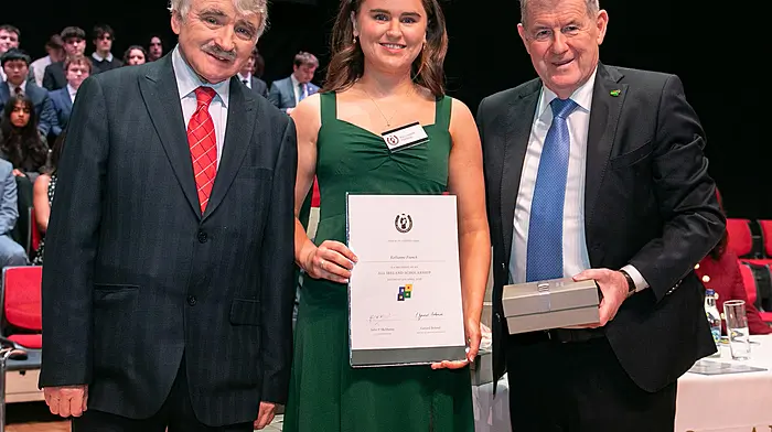 Kellieanne French, a pupil from Mount Saint Michael, Rosscarbery was one of 13 students from Cork who received an All-Ireland scholarship recently at University of Limerick.  Also included in the photo are Willie O'Dea TD and J P McManus, who established the scholarship.