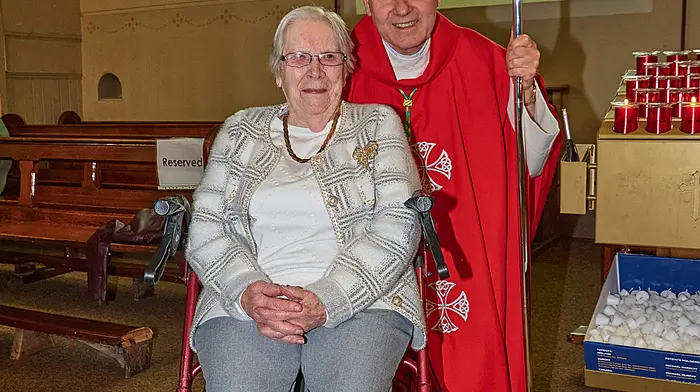 Mary O’Donovan from Newcestown, at the age of 96, meeting the Bishop at St Patrick’s Church in Dunmanway at the confirmation last Tuesday. Mary was there with her great-grand-children Fionn and Nessa Collins.   (Photo: Noel M Photography)