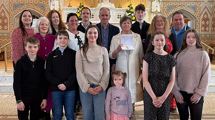 Benemerenti Medal recipient and retired Barryroe Church sacristan Maura Whelton with her extended family in the Church of Our Lady, Star of the Sea, Barryroe following the presentation of the Benemerenti Medal from Pope Leo for her exceptional services to the Catholic church and the local community. The presentation was made by Most Reverend Fintan Gavin, Bishop of Cork and Ross.   Photo courtesty of Paul Finn.