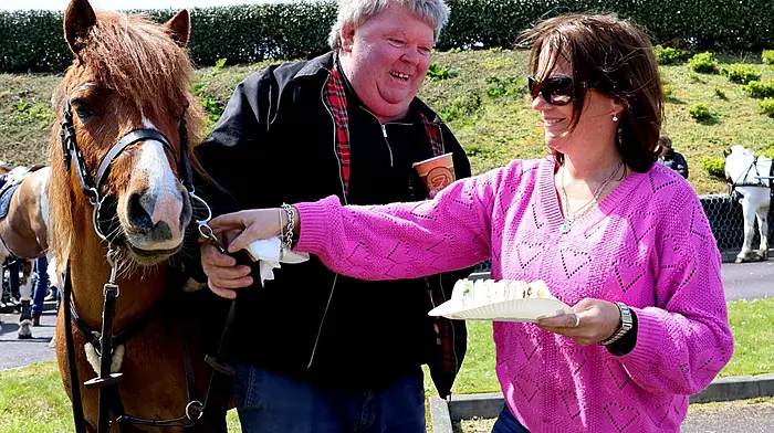 Councillor Caroline Cronin handing out the sandwiches with William Jones at Schull Community Hospital as part of the tour of the Schull cheval.  Photo courtesy of Aughadown Community Photos.